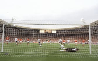 18 Jun 1996:  Alan Shearer of England scores a penalty against Holland in the Group A match at Wembley during the European Football Championships. England beat Holland 4-1.