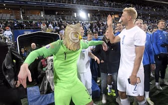 Goalkeeper Lukas Hradecky (L) of Finland wears a mask of an eagle owl as he celebrates with Paulus Arajuuri after the UEFA Euro 2020 Group J qualification football match between Finland and Liechtenstein in Helsinki, Finland, on November 15, 2019. - Finland has qualified for the first time for a major football tournament. (Photo by Markku Ulander / Lehtikuva / AFP) / Finland OUT (Photo by MARKKU ULANDER/Lehtikuva/AFP via Getty Images)