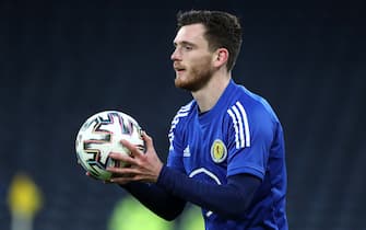 Scotland's Andrew Robertson warming up prior to kick-off during the 2022 FIFA World Cup Qualifying match at Hampden Park, Glasgow. Picture date: Wednesday March 31, 2021.
