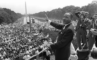 WASHINGTON, UNITED STATES:  (FILES) US civil rights leader Martin Luther King, Jr., waves to supporters from the steps of the Lincoln Memorial 28 August, 1963, on The Mall in Washington, DC, during the "March on Washington" where King delivered his famous "I Have a Dream" speech, which is credited with mobilizing supporters of desegregation and prompted the 1964 Civil Rights Act. The US is celebrating in 2004 what would have been King's 75th birthday. King was assassinated on 04 April, 1968, in Memphis, Tennessee.  AFP PHOTO/FILES  (Photo credit should read -/AFP/Getty Images)