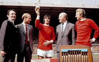 File photo dated 19-04-1969 of Manchester United's George Best (c) shows off the 1968 European Footballer of the Year award, which journalist Max Urbini (l) presented to him before the match, as teammates Bobby Charlton (second l, 1966 winner) and Denis Law (r, 1964 winner), and manager Matt Busby (second r) look on. PRESS ASSOCIATION Photo. Issue date: Friday November 20, 2015. At Manchester United the honours flowed - two league titles, the club's first ever European Cup, a Ballon d'Or and a highlights reel to match the best in history - but it was a curiosity that Best managed only 37 appearances and nine goals for Northern Ireland. See PA story SOCCER Best Overview. Photo credit should read PA Photos/PA Wire.
