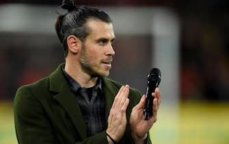 epa10547604 Former Welsh international Gareth Bale applauds fans after speaking to them before the UEFA EURO 2024 qualification match between Wales and Latvia in Cardiff, Britain, 28 March 2023. Bale retired from the national team after the FIFA World Cup in Qatar.  EPA/Peter Powell