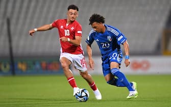 TA' QALI, MALTA - JULY 3: Luca Koleosho of Italy in action against Dylan Scicluna of Malta during the UEFA European Under-19 Championship Finals 2022/23 group A match between Malta and Italy at the National Stadium on July 3, 2023 in Ta' Qali, Malta. (Photo by Seb Daly - Sportsfile/UEFA via Getty Images)