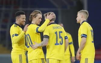 epa08730095 Kristoffer Olsson (2L) and Mattias Johansson (3L) of Sweden celebrate winning the international friendly soccer match between Russia and Sweden at VTB Arena in Moscow, Russia, 08 October 2020.  EPA/MAXIM SHIPENKOV