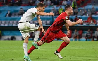 02 July 2021, Bavaria, Munich: Football: European Championship, Belgium - Italy, final round, quarter-final in the EM-Arena Munich. Italy's Nicolo Barella (l) scores the goal for 0:1. Photo: Federico Gambarini/dpa