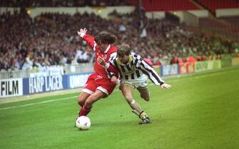 829823578 An Ascoli player holds off Notts County's Andy Legg (r) during the Anglo-Italian Cup final at Wembley. Notts County won the match 2-1. (Photo by Derek Cox - PA Images/PA Images via Getty Images)