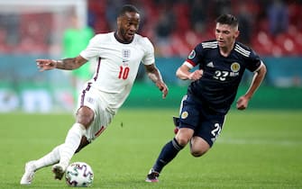 England's Raheem Sterling (left) and Scotland's Billy Gilmour battle for the ball during the UEFA Euro 2020 Group D match at Wembley Stadium, London. Picture date: Friday June 18, 2021.