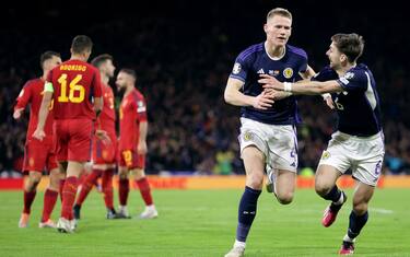 Scotland's Scott McTominay (second right) celebrates scoring their side's second goal of the game with team-mate Kieran Tierney (right) during the UEFA Euro 2024 qualifying group A match at Hampden Park, Glasgow. Picture date: Tuesday March 28, 2023.