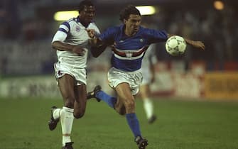 9 May 1990:  Roberto Mancini (right) of Sampdoria holds off Stephen Keshi (left #4) of Anderlecht during the European Cup Winners Cup Final match in Gothenburg, Sweden. Sampdoria won the match 2-0. \ Mandatory Credit: Ben  Radford/Allsport