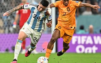 epa10358229 Jurrien Timber (R) of the Netherlands in action against Enzo Fernandez of Argentina during the FIFA World Cup 2022 quarter final soccer match between the Netherlands and Argentina at Lusail Stadium in Lusail, Qatar, 09 December 2022.  EPA/Noushad Thekkayil