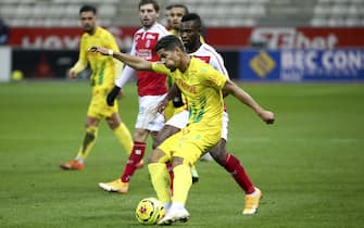 Ludovic Blas of FC Nantes, Ghislain Konan of Reims during the French championship Ligue 1 football match between Stade de Reims and FC Nantes on December 16, 2020 at Stade Auguste Delaune in Reims, France - Photo Jean Catuffe / DPPI / LM