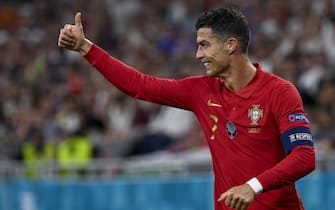 epa09297308 Cristiano Ronaldo of Portugal celebrates aftter he scored a goal during the Portugal vs. France match in the third round of Group F of the Euro 2020 soccer tournament in Puskas Ferenc Arena in Budapest, Hungary, 23 June 2021.  EPA/Zsolt Szigetvary HUNGARY OUT