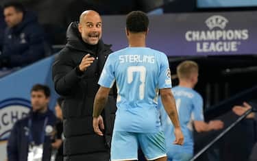 Manchester, England, 24th November 2021. Josep Guardiola manager of Manchester City instructs Raheem Sterling of Manchester City  during the UEFA Champions League match at the Etihad Stadium, Manchester. Picture credit should read: Andrew Yates / Sportimage via PA Images