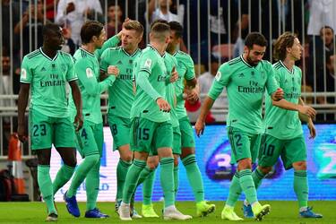 Real Madrid's German midfielder Toni Kroos (3rd-L) celebrates his goal with Real Madrid's Spanish defender Sergio Ramos (2nd-L) during the Spanish Super Cup semi final between Valencia and Real Madrid on January 8, 2020, at the King Abdullah Sport City in the Saudi Arabian port city of Jeddah. (Photo by GIUSEPPE CACACE / AFP) (Photo by GIUSEPPE CACACE/AFP via Getty Images)