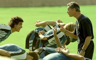 Italian Claudio Ranieri, new coach of Valencia  talking to player Chemo del Solar during his first training with the Spanish soccer team here 21 September.