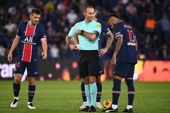 French referee Jerome Brisard (C) reacts   during the French L1 football match between Paris Saint-Germain (PSG) and Marseille (OM) at the Parc de Princes stadium in Paris on September 13, 2020. (Photo by FRANCK FIFE / AFP) (Photo by FRANCK FIFE/AFP via Getty Images)