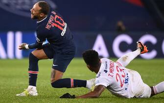 Paris Saint-Germain's Brazilian forward Neymar (L) is tackled by Lyon's Dutch defender Kenny Tete during the French L1 football match between Paris Saint-Germain (PSG) and Lyon (OL), on December 13, 2020 at the Parc des Princes stadium in Paris. (Photo by FRANCK FIFE / AFP) (Photo by FRANCK FIFE/AFP via Getty Images)