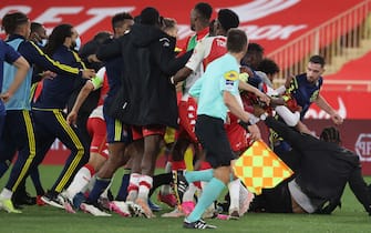 Players fight a the end of the L1 football match between Monaco (ASM) and Lyon (OL) at The Louis II Stadium, in Monaco on May 2, 2021. (Photo by Valery HACHE / AFP) (Photo by VALERY HACHE/AFP via Getty Images)
