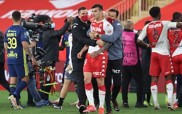 Players argue a the end of the L1 football match between Monaco (ASM) and Lyon (OL) at The Louis II Stadium, in Monaco on May 2, 2021. (Photo by Valery HACHE / AFP) (Photo by VALERY HACHE/AFP via Getty Images)