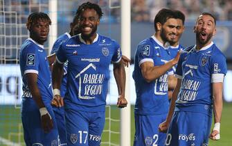 Troyes' teammates celebrate after Troyes' forward Dylan Saint-Louis (2ndL) scored a goal during the French Ligue 2 football match between Troyes and Dunkerque on May 8, 2021 at the Aube Stadium in Troyes. (Photo by FRANCOIS NASCIMBENI / AFP) (Photo by FRANCOIS NASCIMBENI/AFP via Getty Images)