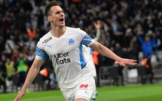 1238189986 Marseille's Polish forward Arkadiusz Milik celebrates scoring his team's fourth goal during the French L1 football match between Olympique Marseille (OM) and SCO Angers at Stade Velodrome in Marseille, southern France, on February 4, 2022. (Photo by Nicolas TUCAT / AFP) (Photo by NICOLAS TUCAT/AFP via Getty Images)