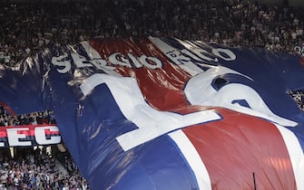 epa10671258 Supporters deploy a giant Sergio Rico team jersey in support of the player who was injured after falling from a horse in Spain, prior to the French Ligue 1 soccer match between Paris Saint Germain and Clermont Foot 63 in Paris, France, 03 June 2023.  EPA/CHRISTOPHE PETIT TESSON