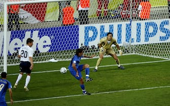 KAISERSLAUTERN, GERMANY - JUNE 17:  The ball deflects off Cristian Zaccardo (C) of Italy and into the net for an own goal during the FIFA World Cup Germany 2006 Group E match between Italy and USA at the Fritz-Walter Stadium on June 17, 2006 in Kaiserslautern, Germany.  (Photo by Michael Steele/Getty Images)