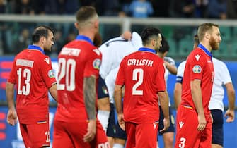 Armenia's players show their dejection while Italy's players celebrate the 6-0 goal score by Alessio Romagnoli during the UEFA Euro 2020 group J qualifying soccer match between Italy and Armenia at the Renzo Barbera stadium in Palermo, Italy, 18 November 2019. 
ANSA/CARMELO IMBESI
