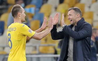 epa08742268 Head coach Andriy Shevchenko (C) of Ukraine celebrates his team’s victory with Yevhen Makarenko (L) after the UEFA Nations League group stage, league A, group 4 soccer match between Ukraine and Spain in Kiev, Ukraine, 13 October 2020.  EPA/SERGEY DOLZHENKO