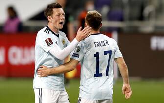 epa09103857 Ryan Fraser of Scotland celebrates with teammate Callum McGregor after scoring during the FIFA World Cup 2022 qualifying soccer match between Israel and Scotland in Tel Aviv, Israel, 28 March 2021.  EPA/Atef Safadi