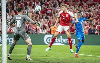 epa09454278 Denmark's Andreas Cornelius scores 5-0 and Israel's Ofir Marciano and Israel's Gadi Kinda must watch during the FIFA World Cup 2022 qualifiers Group F match between Denmark and Israel in Copenhagen, Denmark, 07 September 2021.  EPA/Mads Claus Rasmussen  DENMARK OUT