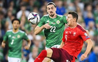 epa09456325 Northern Ireland's Ciaron Brown (L) in action against Switzerland's Christian Fassnacht (R) during the FIFA World Cup 2022 group C qualifying soccer match between Northern Ireland and Switzerland at Windsor Park stadium in Belfast, Northern Ireland, Britain, 08 September 2021.  EPA/GIAN EHRENZELLER