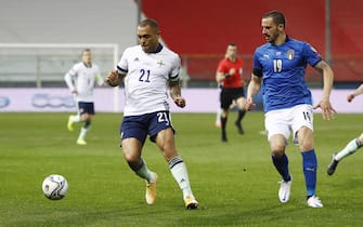 Italy's Leonardo Bonucci (R) and Northern Ireland's  Josh Magennis (L) in action during the FIFA World Cup Qatar 2022 qualification round one soccer match Italy vs  Northern Ireland at Ennio Tardini stadium in Parma, Italy, 25 March 2021. ANSA / ELISABETTA BARACCHI