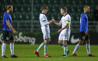 Northern Ireland's Conor Bradley, 2nd left, and Shane Ferguson celebrate their victory in the international friendly soccer match between Estonia and Northern Ireland at the A. Le Coq Arena in Tallinn, Estonia, Sunday, Sept. 5, 2021. (AP Photo/Raul Mee)