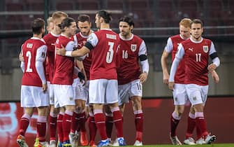Austria's players celebrates after scoring the opening goal during the FIFA World Cup Qatar 2022 qualification Group F football match Austria v Moldova in Klagenfurt, southern Austria, on November 15, 2021. - Austria OUT (Photo by Johann GRODER / APA / AFP) / Austria OUT (Photo by JOHANN GRODER/APA/AFP via Getty Images)