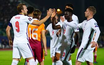 England's Harry Kane (left) celebrates scoring their side's third goal of the game during the FIFA World Cup Qualifying match at the San Marino Stadium, Serravalle. Picture date: Monday November 15, 2021.
