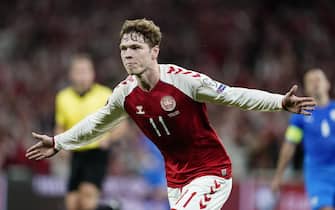 epa09454153 Denmark's Andreas Skov Olsen celebrates after scoring the team's third goal during the FIFA World Cup 2022 qualifiers Group F match between Denmark and Israel in Copenhagen, Denmark, 07 September 2021.  EPA/Mads Claus Rasmussen  DENMARK OUT