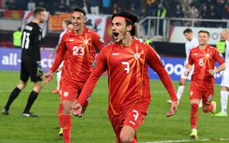 epa09582277 North Macedonia’s Elif Elmas (C) reacts with teammates after scoring the 3-1 lead during the FIFA World Cup 2022 qualifying group J soccer match between North Macedonia and Iceland in Skopje, Republic of North Macedonia, 14 November 2021.  EPA/NAKE BATEV