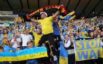 epa09990677 Ukrainian supporters react during the FIFA World Cup 2022 qualification playoff semi final soccer match between Scotland and Ukraine at Hampden Park in Glasgow, Scotland, Britain, 01 June 2022.  EPA/Robert Perry