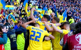Ukraine's Roman Yaremchuk (centre) celebrates in front of the fans after scoring their side's second goal of the game during the FIFA World Cup 2022 Qualifier play-off semi-final match at Hampden Park, Glasgow. Picture date: Wednesday June 1, 2022. (Photo by Andrew Milligan/PA Images via Getty Images)