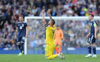 epa09990435 Ukraine's captain Andriy Yarmolenko (C) reacts after scoring the opening goal during the FIFA World Cup 2022 qualification playoff semi final soccer match between Scotland and Ukraine at Hampden Park in Glasgow, Scotland, Britain, 01 June 2022.  EPA/Robert Perry