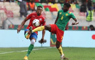 epa09716709 Andre Zambo Anguissa of Cameroon (R) tackles Muhammed Badamosi of Gambia during the 2021 Africa Cup of Nations AFCON quarterfinal soccer match between Gambia and Cameroon at Japoma Stadium, Douala, Cameroon, 29 January 2022.  EPA/Gavin Barker EDITORIAL USE ONLY  EDITORIAL USE ONLY