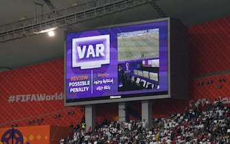 The big screen indicates that VAR is reviewing a possible foul, before awarding Iran a penalty the FIFA World Cup Group B match at the Khalifa International Stadium in Doha, Qatar. Picture date: Monday November 21, 2022.