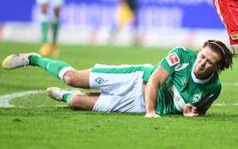 02 January 2021, Bremen: Football: Bundesliga, Werder Bremen - 1.FC Union Berlin, Matchday 14. Werder's Niclas Füllkrug on the ground after a duel. Photo: Carmen Jaspersen/dpa - IMPORTANT NOTE: In accordance with the regulations of the DFL Deutsche Fußball Liga and/or the DFB Deutscher Fußball-Bund, it is prohibited to use or have used photographs taken in the stadium and/or of the match in the form of sequence pictures and/or video-like photo series.