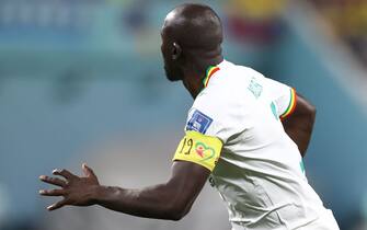 DOHA, QATAR - NOVEMBER 29: Number 19 on the captains armband of Kalidou Koulibaly of Senegal in memory of Papa Bouba Diop during the FIFA World Cup Qatar 2022 Group A match between Ecuador and Senegal at Khalifa International Stadium on November 29, 2022 in Doha, Qatar. (Photo by James Williamson - AMA/Getty Images)