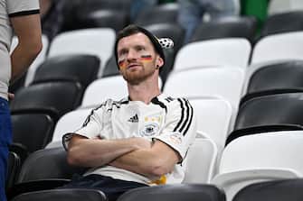 AL KHOR, QATAR - DECEMBER 01: Germany fans look dejected after their sides' elimination from the tournament the FIFA World Cup Qatar 2022 Group E match between Costa Rica and Germany at Al Bayt Stadium on December 01, 2022 in Al Khor, Qatar. (Photo by Stuart Franklin/Getty Images)