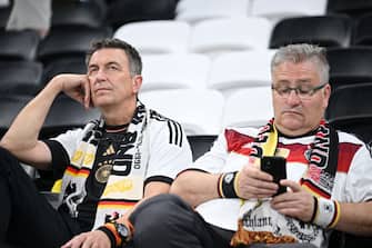 AL KHOR, QATAR - DECEMBER 01: Germany fans look dejected after their sides' elimination from the tournament during the FIFA World Cup Qatar 2022 Group E match between Costa Rica and Germany at Al Bayt Stadium on December 01, 2022 in Al Khor, Qatar. (Photo by Stuart Franklin/Getty Images)