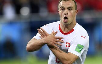 epa06832045 Switzerland's midfielder Xherdan Shaqiri celebrates after scoring the winning goal during the FIFA World Cup 2018 group E preliminary round soccer match between Switzerland and Serbia in Kaliningrad, Russia, 22 June 2018. Switzerland won 2-1.

(RESTRICTIONS APPLY: Editorial Use Only, not used in association with any commercial entity - Images must not be used in any form of alert service or push service of any kind including via mobile alert services, downloads to mobile devices or MMS messaging - Images must appear as still images and must not emulate match action video footage - No alteration is made to, and no text or image is superimposed over, any published image which: (a) intentionally obscures or removes a sponsor identification image; or (b) adds or overlays the commercial identification of any third party which is not officially associated with the FIFA World Cup)  EPA/LAURENT GILLIERON   EDITORIAL USE ONLY