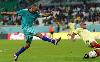 Team A's Cafu shoots past Team B's Roberto Carlos during a Workers and FIFA Legends Match at the Al Thumama Stadium, Doha, Qatar. Picture date: Monday December 12, 2022.