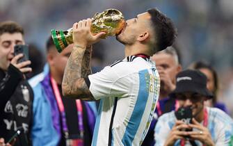 Argentina's Leandro Paredes kisses the World Cup Trophy following victory in the FIFA World Cup final at Lusail Stadium, Qatar. Picture date: Sunday December 18, 2022.